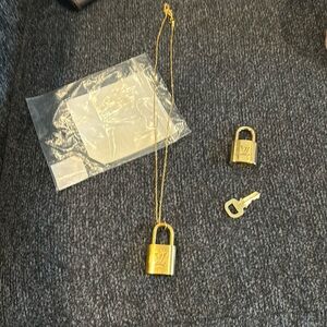 Authentic Louis Vuitton 2 gold locks and one key